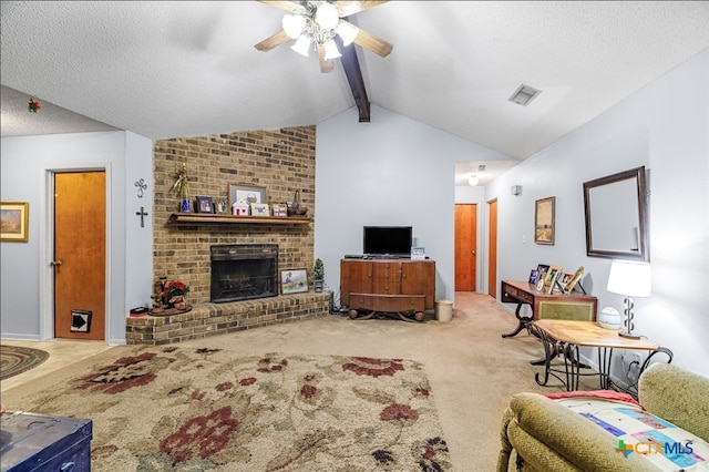 carpeted living room featuring a textured ceiling, vaulted ceiling with beams, ceiling fan, and a fireplace