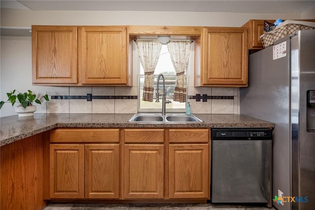 kitchen featuring sink, tasteful backsplash, and appliances with stainless steel finishes