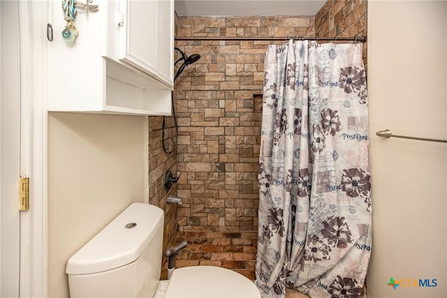 bathroom with walk in shower and toilet