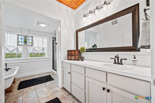 bathroom with wooden walls, vanity, wood ceiling, an enclosed shower, and tile patterned floors