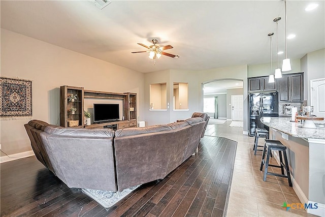 822 Old World Dr, Harker Heights, TX 76548 - living room with arched walkways, a ceiling fan, dark wood-type flooring, and recessed lighting