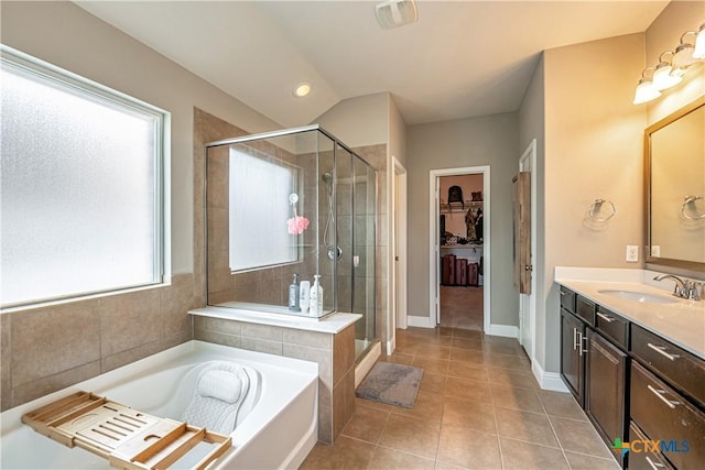 822 Old World Dr, Harker Heights, TX 76548 - bathroom featuring vanity, a shower stall, a bath, tile patterned flooring, and a spacious closet