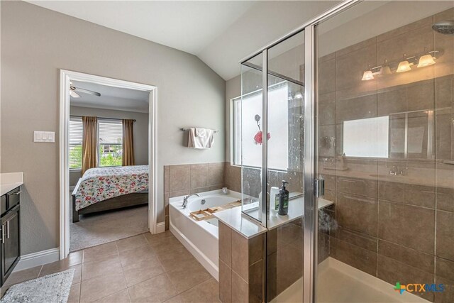 822 Old World Dr, Harker Heights, TX 76548 - ensuite bathroom featuring a bath, vanity, tile patterned floors, a stall shower, and lofted ceiling