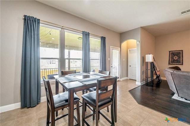822 Old World Dr, Harker Heights, TX 76548 - dining room with arched walkways, healthy amount of natural light, and light tile patterned floors