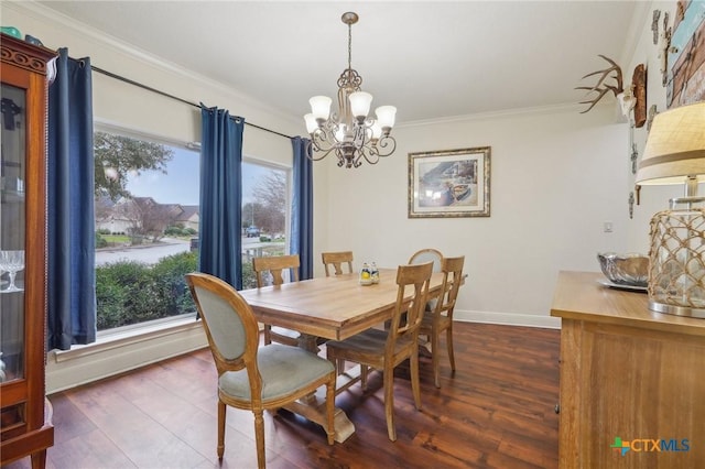 dining room featuring a chandelier, crown molding, and dark hardwood / wood-style flooring