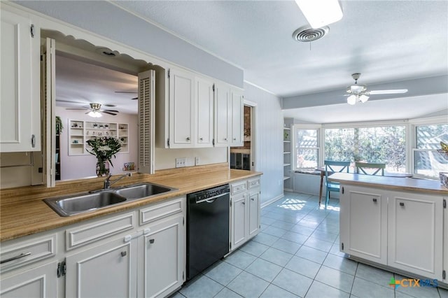 kitchen with light tile patterned flooring, white cabinetry, dishwasher, sink, and ceiling fan