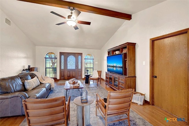 living room with light wood-type flooring and a ceiling fan