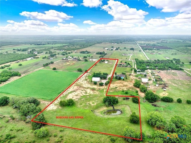 overview of rural landscape featuring property parcel outlined and rows of crops