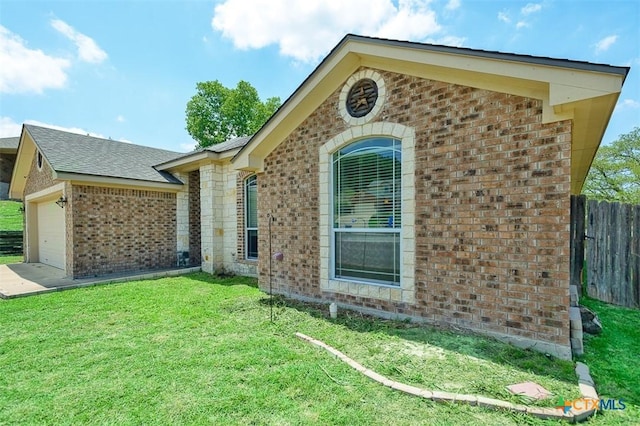 2406 Peace Pipe Cir, Copperas Cove, TX 76522 - view of side of home featuring brick siding and a garage