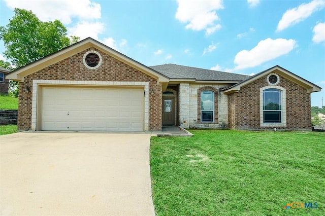 2406 Peace Pipe Cir, Copperas Cove, TX 76522 - view of front of home featuring brick siding, concrete driveway, a front yard, and an attached garage