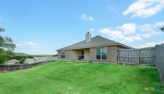2406 Peace Pipe Cir, Copperas Cove, TX 76522 - rear view of house featuring brick siding, a chimney, and roof with shingles