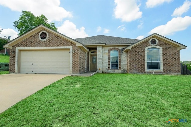 2406 Peace Pipe Cir, Copperas Cove, TX 76522 - ranch-style home with brick siding, a garage, driveway, a front yard, and roof with shingles