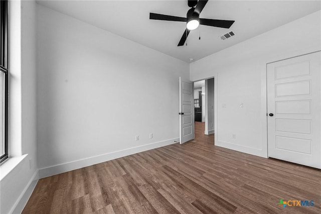 unfurnished bedroom with hardwood / wood-style flooring