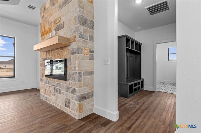 interior space with dark hardwood / wood-style flooring and a fireplace