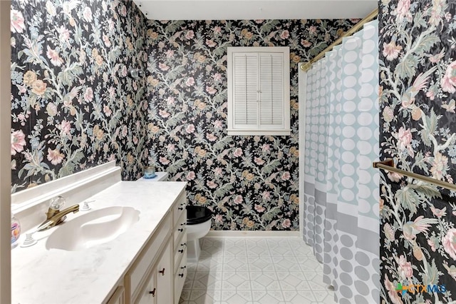 304 Simpson Rd, Victoria, TX 77904 - bathroom featuring wallpapered walls, vanity, and tile patterned flooring
