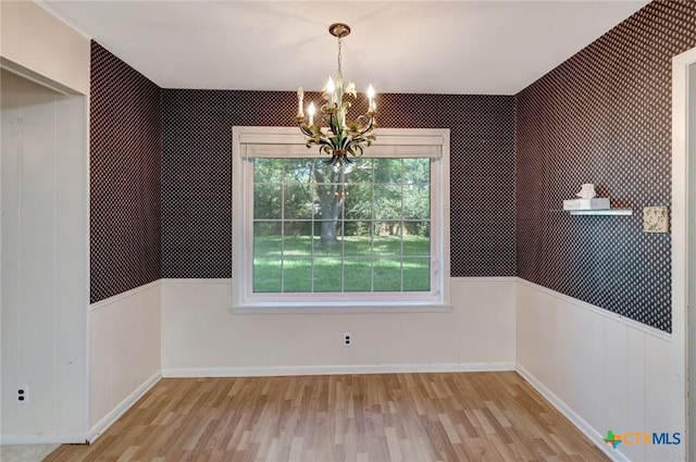 304 Simpson Rd, Victoria, TX 77904 - unfurnished dining area featuring light wood-style flooring and a chandelier
