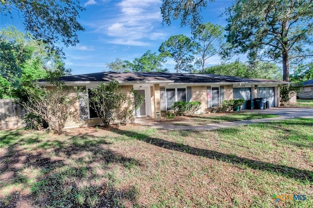 304 Simpson Rd, Victoria, TX 77904 - ranch-style house with a garage and driveway