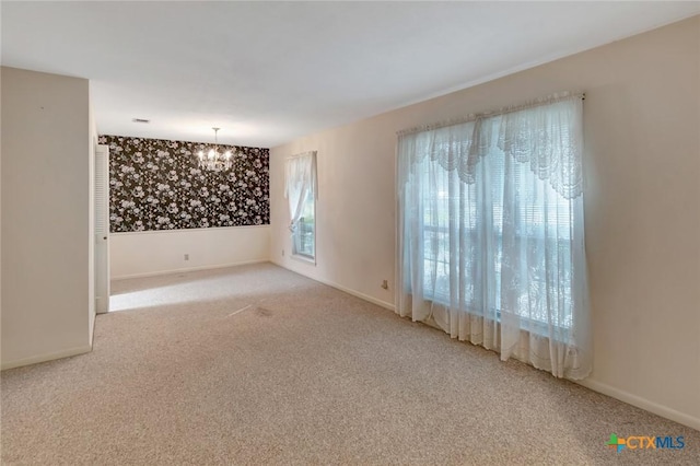304 Simpson Rd, Victoria, TX 77904 - spare room featuring a chandelier and carpet floors