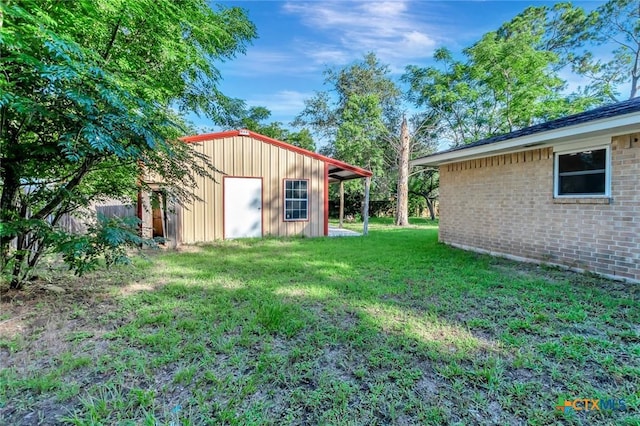 304 Simpson Rd, Victoria, TX 77904 - view of grassy yard with an outbuilding