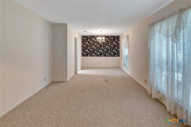 304 Simpson Rd, Victoria, TX 77904 - empty room with a chandelier and light carpet