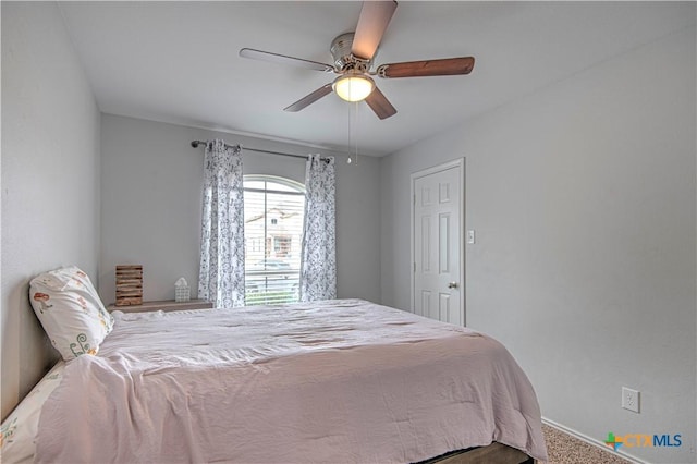 bedroom with ceiling fan and carpet flooring