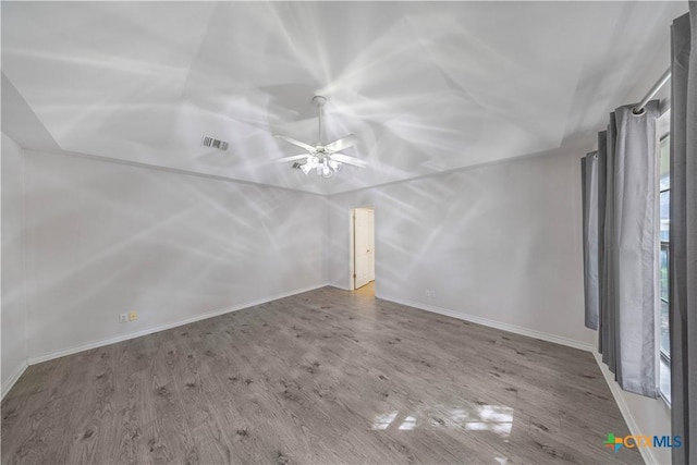 607 Topaz Ave, Seguin, TX 78155 - spare room featuring wood finished floors, a ceiling fan, baseboards, and lofted ceiling