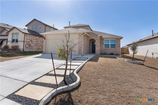 view of front of house with brick siding, concrete driveway, a garage, and fence