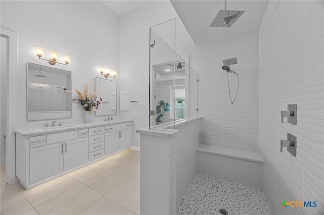 120 Diamondback Dr, Georgetown, TX 78628 - full bathroom with a walk in shower, double vanity, and tile patterned flooring