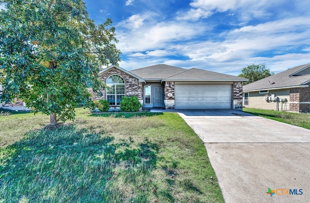 ranch-style house with a garage and a front lawn