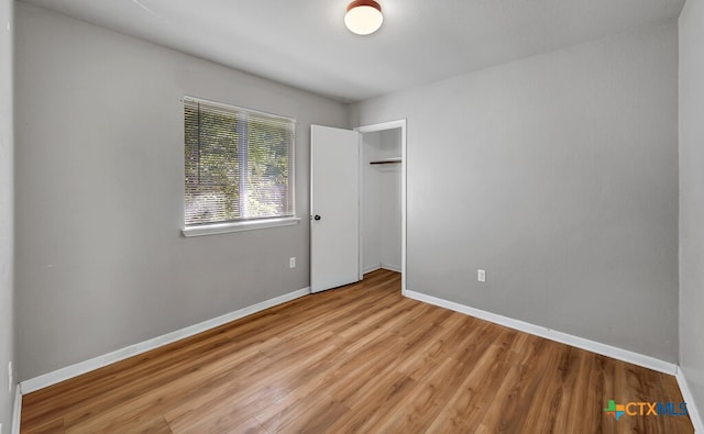 unfurnished bedroom featuring light wood-type flooring