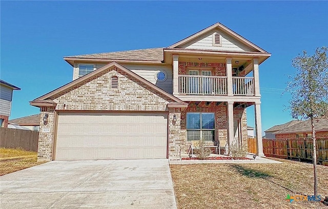 view of front facade featuring a front lawn, a garage, and a balcony