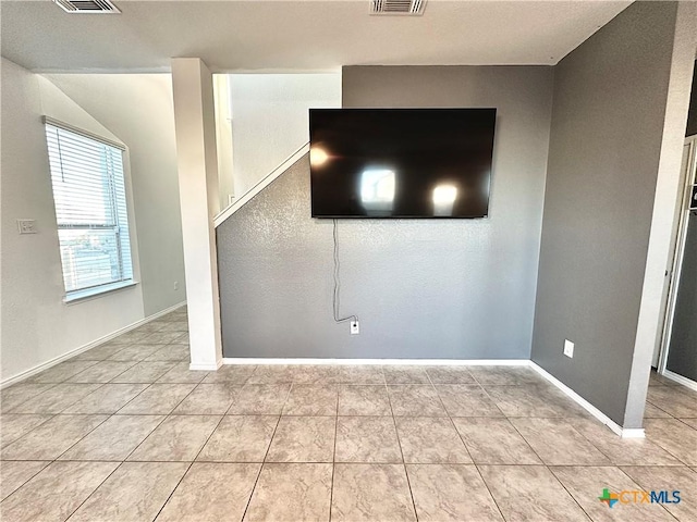 interior space with light tile patterned floors