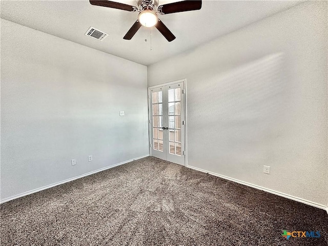 carpeted empty room with ceiling fan and french doors