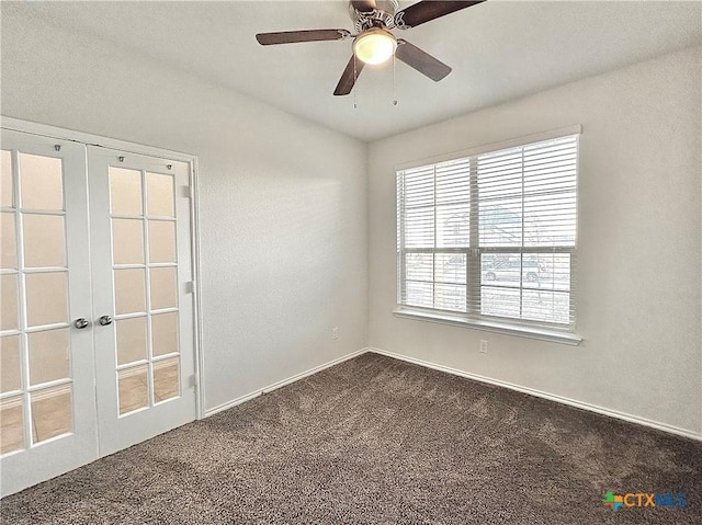 carpeted empty room featuring ceiling fan and french doors