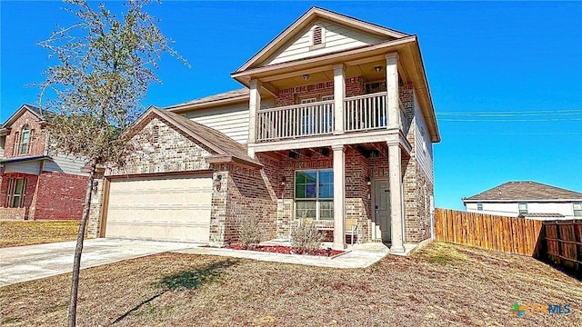 view of front of home with a balcony and a garage