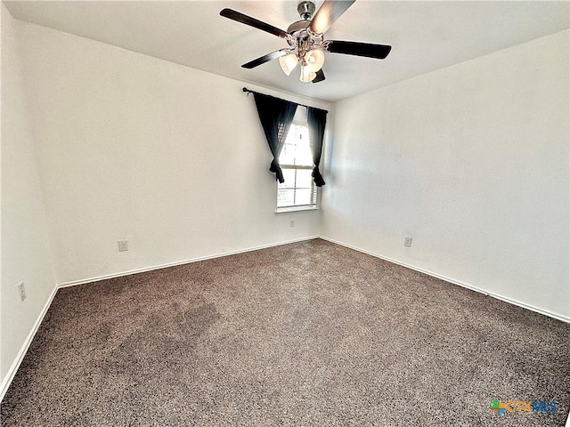 unfurnished room with ceiling fan and carpet