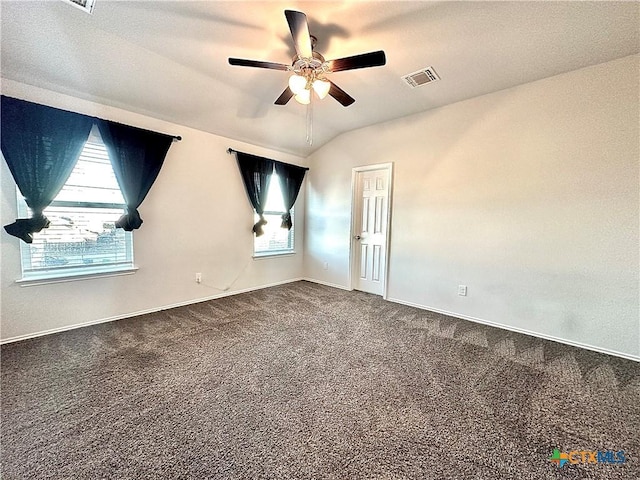 spare room featuring carpet floors, ceiling fan, and lofted ceiling