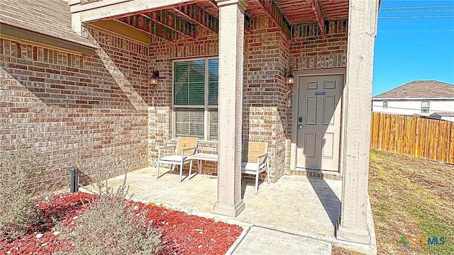 doorway to property featuring a patio area