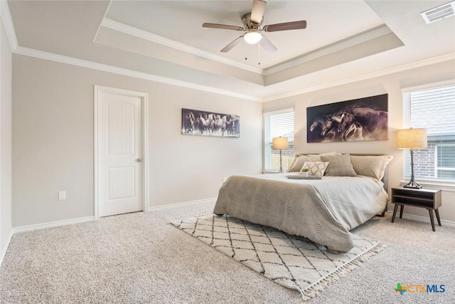 1306 Campbelton Dr, Temple, TX 76504 - bedroom featuring a tray ceiling, multiple windows, light carpet, and ornamental molding