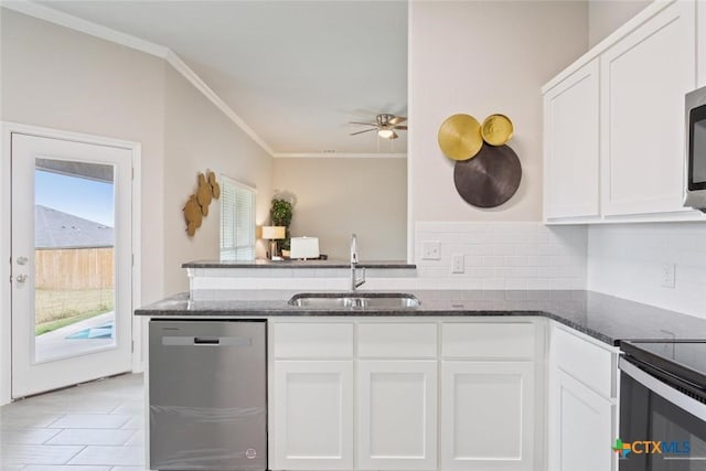 1306 Campbelton Dr, Temple, TX 76504 - kitchen with ornamental molding, appliances with stainless steel finishes, dark stone counters, white cabinets, and ceiling fan