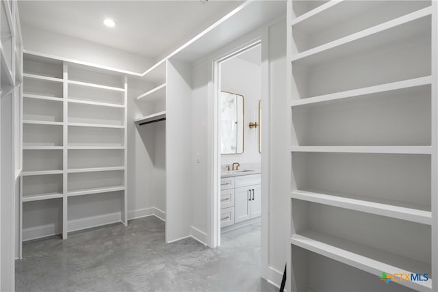 walk in closet featuring sink