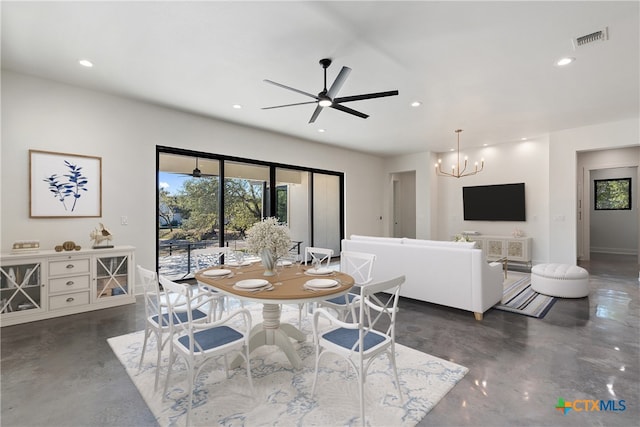 dining space featuring ceiling fan with notable chandelier