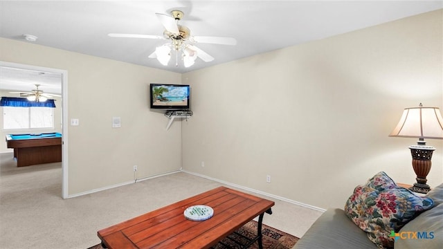 carpeted living area with billiards, a ceiling fan, and baseboards