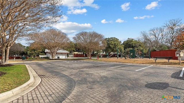 uncovered parking lot featuring playground community