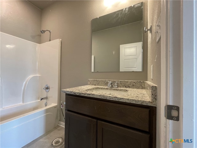 bathroom with vanity and bathtub / shower combination