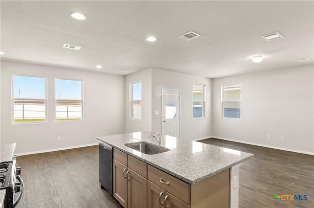 192 Lavender Ln, Elgin, TX 78621 - kitchen with appliances with stainless steel finishes, a sink, baseboards, dark wood-type flooring, and visible vents