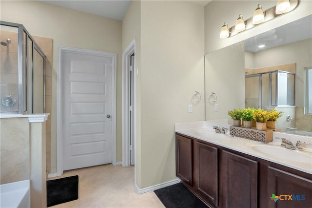 bathroom featuring vanity, tile patterned floors, and a shower with door