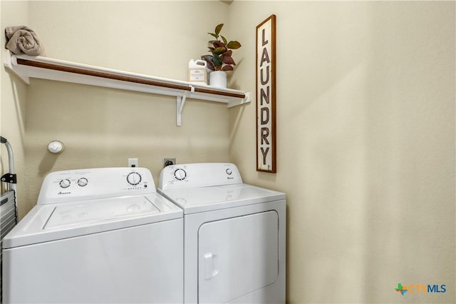 laundry area featuring washing machine and clothes dryer