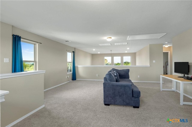 carpeted living room with a wealth of natural light