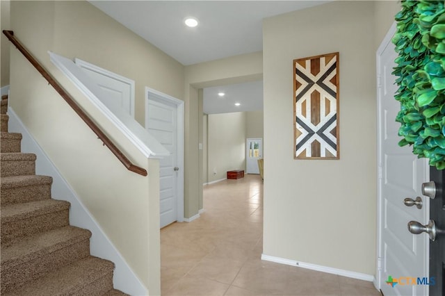 entrance foyer with light tile patterned floors